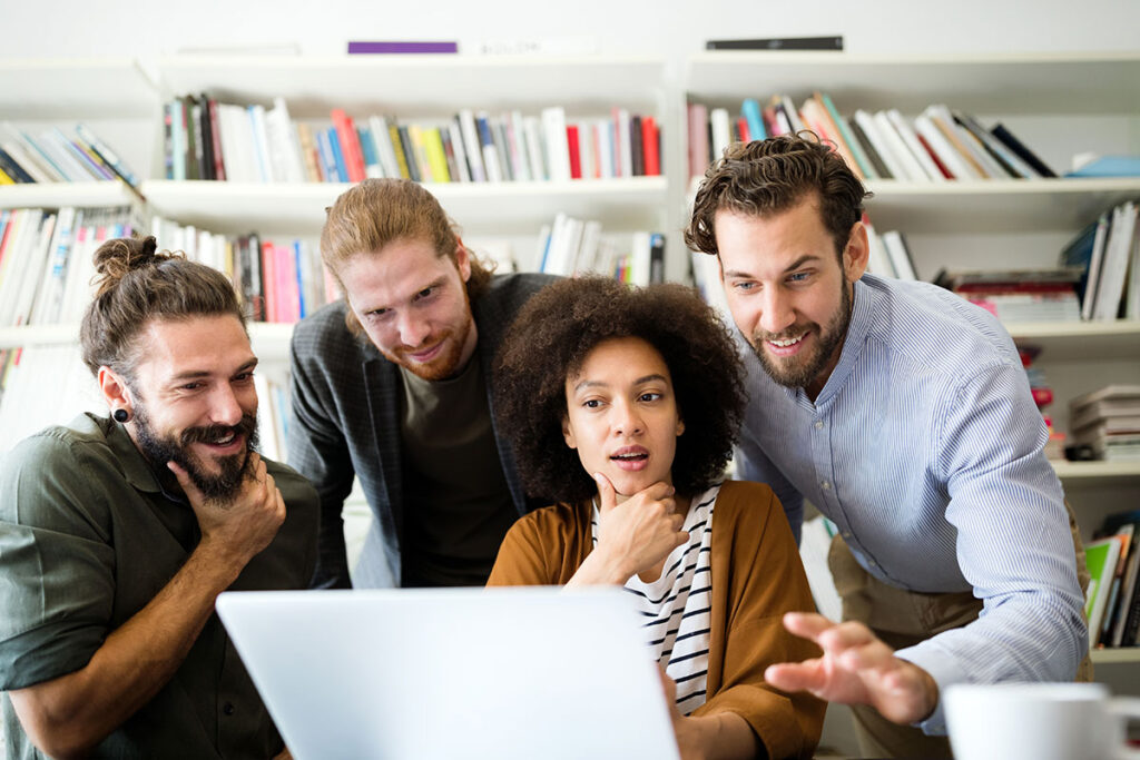 Team of digital marketing professionals collaborating at SnuggleCub Creations